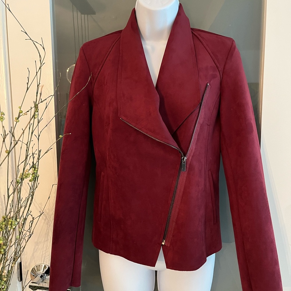Ultra suede burgundy moto jacket with asymmetrical zipper with side pockets.